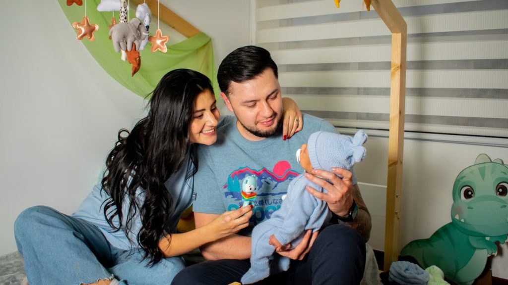 A happy family enjoys a cozy moment in the baby's nursery, filled with love and warmth.